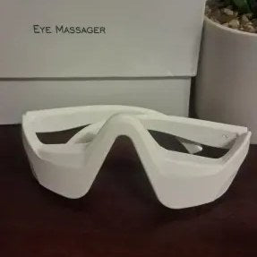 Photo client : lunettes anti-cernes blanches posées devant leur boîte